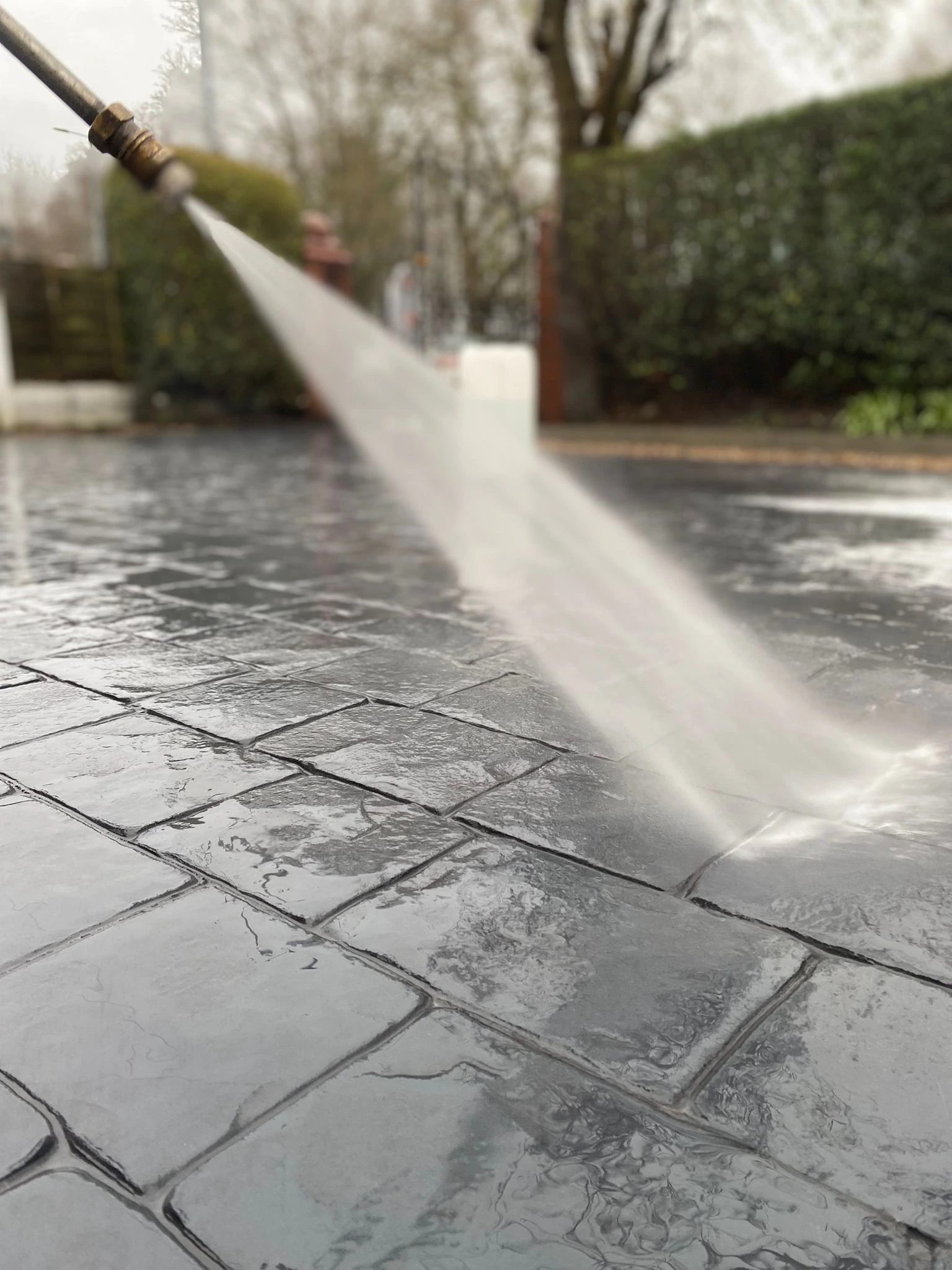 Imprinted concrete driveway in Manchester with slate-effect pattern